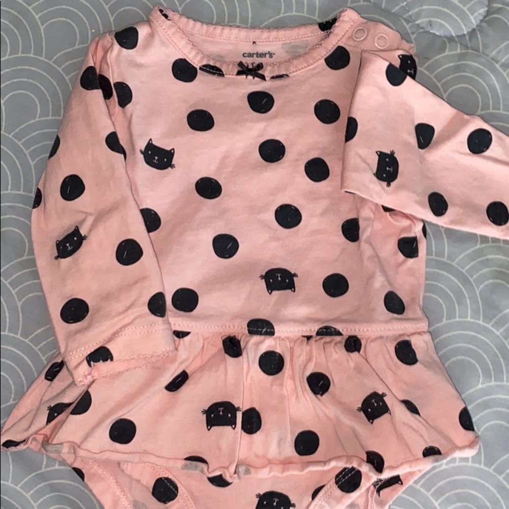 Pink peplum onesie